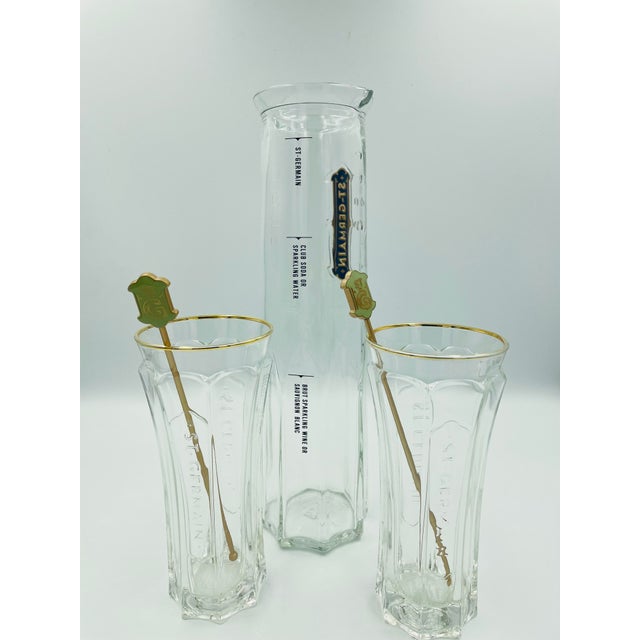 Elevate your home bar with this sophisticated St-Germain cocktail set, featuring a beautifully faceted glass carafe, two...