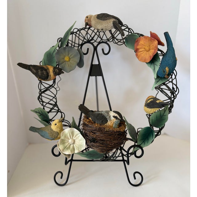 A sculptural interpretation of nature, this vintage botanical bird wreath brings together layered elements of form,...