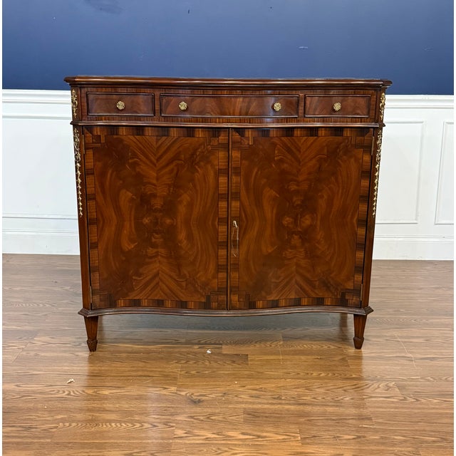 This is a traditional serpentine door cabinet/commode made by Leighton Hall. It features a serpentine front with two doors...