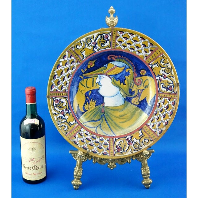 Item : Beautiful, large, glazed and vitrified ceramic plate, entirely hand-decorated. The rim features a portrait of...