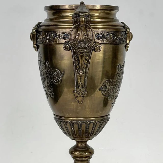 Pair of 19th Century French Napoleon III Period Bronze & Brass Urns represent the mastery of metal sculpture exhibited by...
