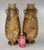 A striking pair of footed Japanese Satsuma vases, each decorated with a bold palm leaf motif in warm golden tones. The...
