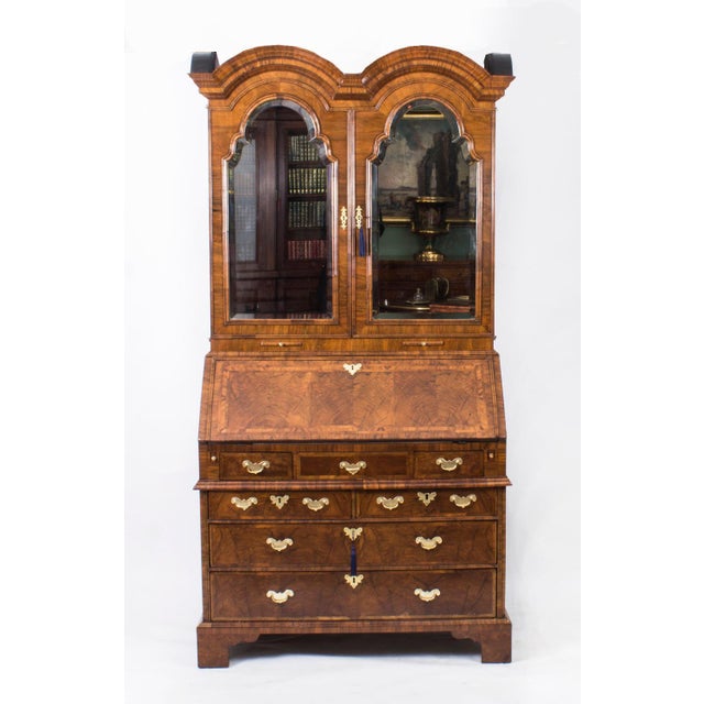 This is a superb antique Queen Anne Bureau Bookcase, Circa 1720 in age. It is surmounted with a lovely double-domed...