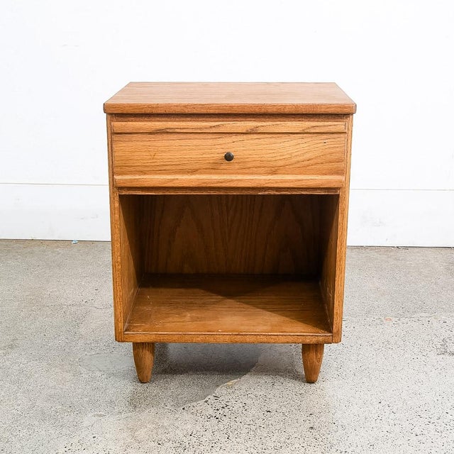High quality solid oak single nightstand by unknown designer. Unique American made piece ready for your home or space....
