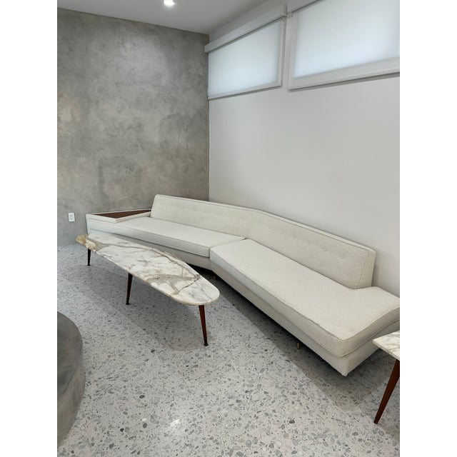 1960s white boucle mid century modern boomerang sofa. Adrian Pearsall style. Acorn color wood table built into the...