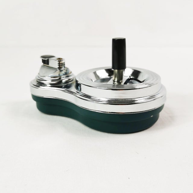 Desk set (ashtray & lighter), German origin, 1960s. The piece combines a mechanical, spinning self-cleaning ashtray with...