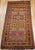 A vibrant and colorful vintage Moroccan area rug has a geometric pattern that is designed to make its presence felt and...