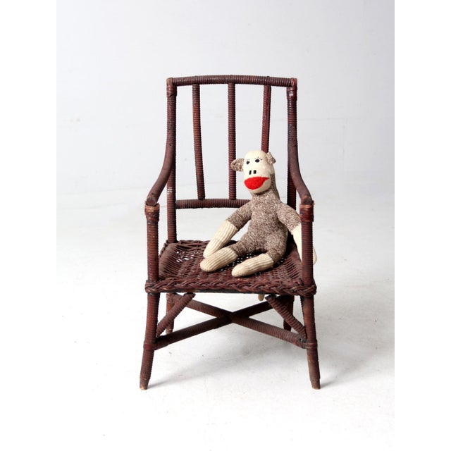 This turn-of-the-century American wicker child’s chair has a gentle, welcoming presence. The bentwood frame and tightly...