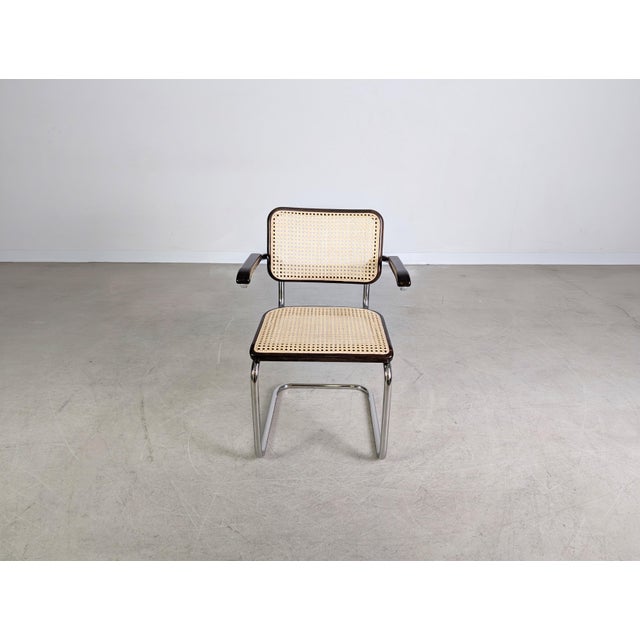 Beautiful Thonet S64V cantilever chair with armrests. Designed by Marcel Breuer in the early 20th century, this chair...
