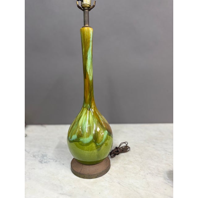 Royal Haeger Pottery Company from 1950s & 60s. A green ceramic drip glaze vase with hints of brown and amber tones. Very...