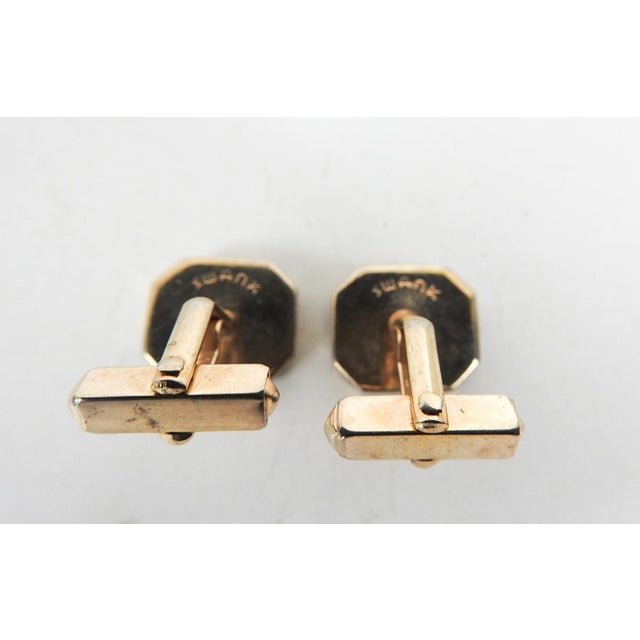 Vintage late 20th century Swank black mother of pearl in goldtone setting cufflinks. Very good condition.