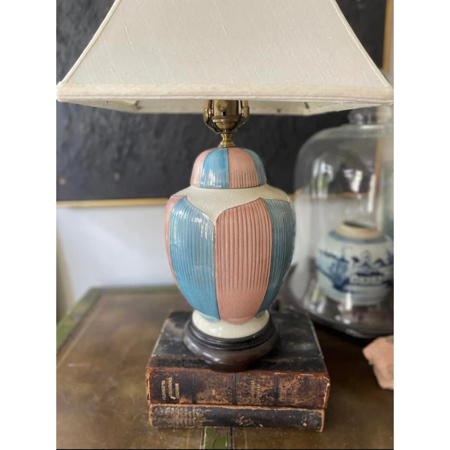 Wonderful high-end lamp by Wildwood, presented in the shape of a ginger jar with a pink and blue vertical pattern with...