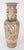 Large pair of hand-painted Cantonese vases in the Family Rose decor with a high neck on which lions and Foo cubs are...