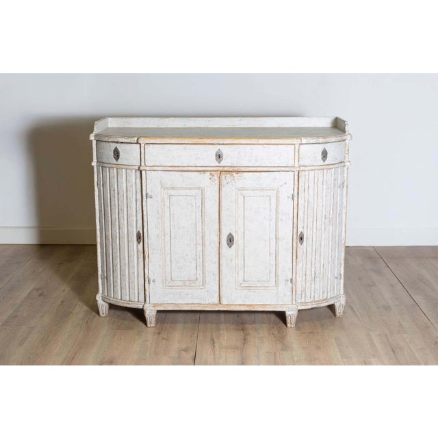 This 18th-century Gustavian sideboard, circa 1790, is a remarkable example of Swedish neoclassical design, blending...