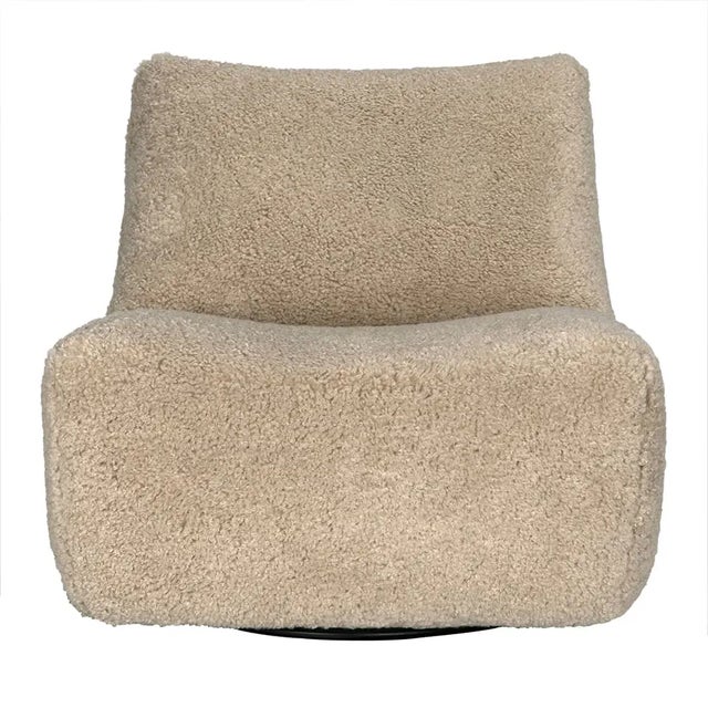 The McClain Swivel Chair combines plush comfort with effortless functionality. Wrapped in soft camel teddy fleece, this...
