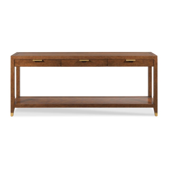 A rectangular framed top is raised by squared corner posts that flank three apron rail drawers over a low shelf....
