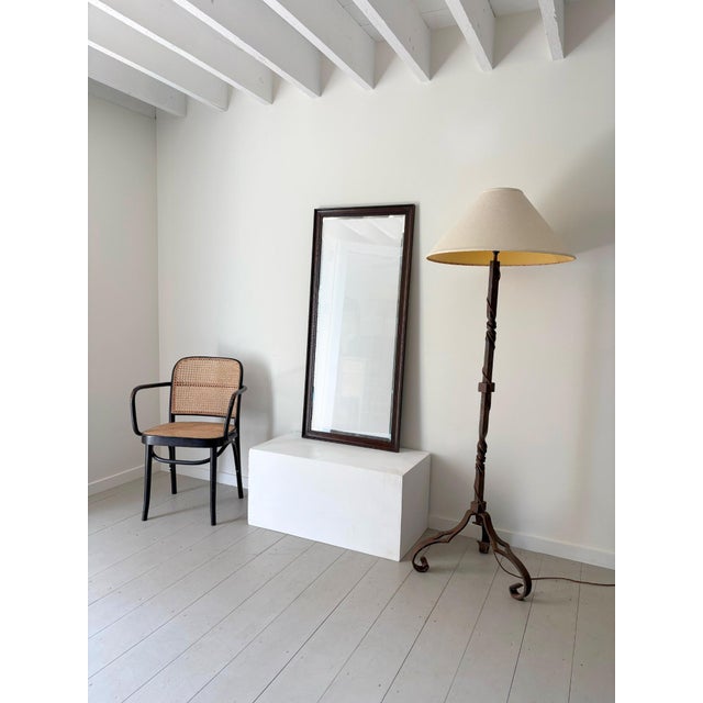 A handsome antique mirror with a stained oak frame and bevelled glass, complete with the original mirror plate and back....