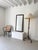A handsome antique mirror with a stained oak frame and bevelled glass, complete with the original mirror plate and back....