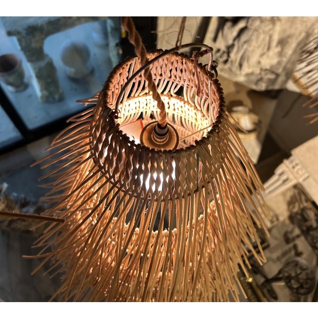More information coming soon… Hand-crafted in France, the numerous strands of rattan that make up these pendant lights...