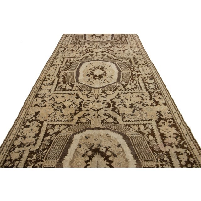 This is a stunning antique Karabaugh hand-knotted wool rug featuring a brown field. It showcases beautiful beige and gray...