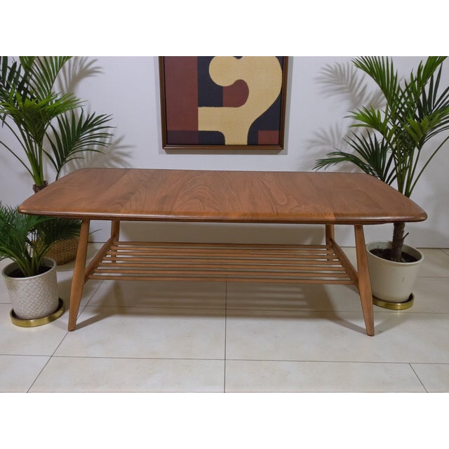 Introducing an exquisite Mid Century Modern gem - the Ercol Solid Elm & Beech Plank Coffee Table, professionally restored...