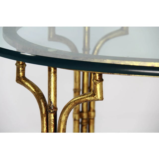 Made in Spain. Fabulous Faux bamboo design with thick glass + substantial oval glass top. Of the period of Hollywood...