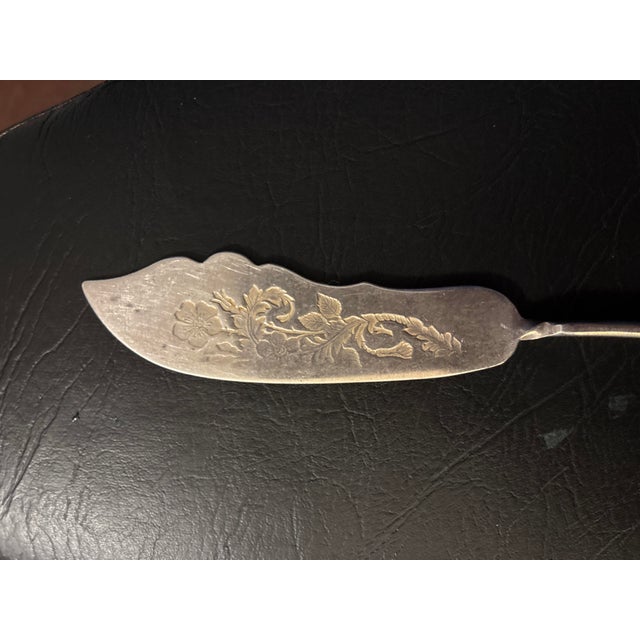 Antique Victorian William Rogers & Son silver-plated fish knife, marked A1, dating to the late 19th century. Features a...
