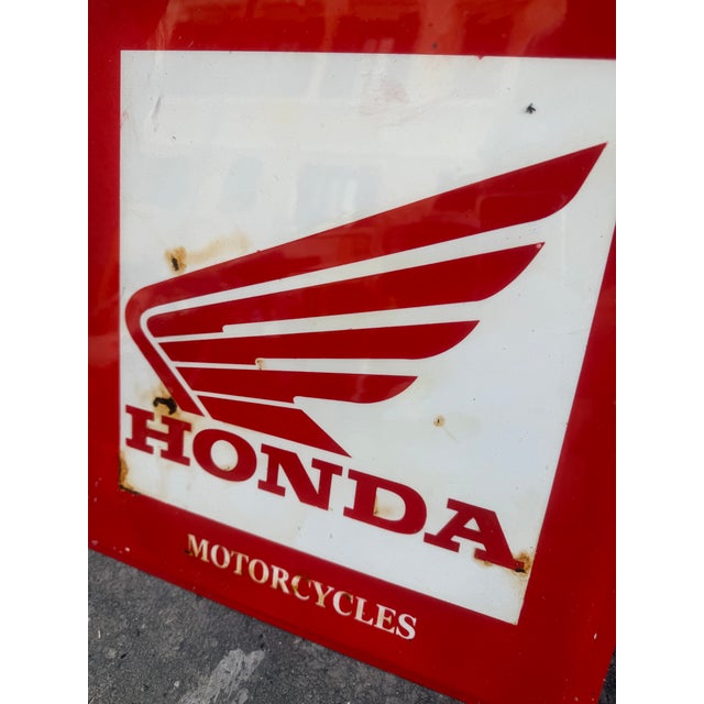 Vintage enamelled iron sign from the well-known Honda brand with some signs of wear due to the passage of time.
