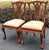 Beautiful pair of Chippendale style dining chairs. Features intricately carved details throughout, upholstered seats and...
