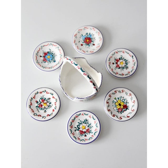 This vintage signed Crespo ceramic coaster set includes six hand-painted faience coasters housed within their original...