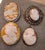 Group of 4 High Relief Cameo Pins/Pendents Carved from Bull Mouth Shell Unmarked Silver Settings 2.5mm x 4mm 4mm x 4mm 2...