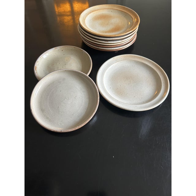 Set of stoneware plates signed Grès du Marais, 1970s 8 plates, 19cm diameter 2 plates, 16cm diameter This piece has an...