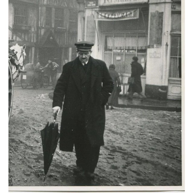 Silver Gelatine Print by Erich Andres, 1941. This photograph, taken in 1941 in Rouen, France, depicts a foggy street scene...