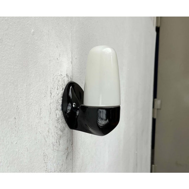 Classic wall lamp by Lindner, designed by Wilhelm Wagenfeld in the 1950s. The 6067 is a functional, elegant, and therefore...