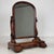 A charming 19th-century English Victorian dressing mirror, finely crafted from mahogany and combining an elegantly shaped...