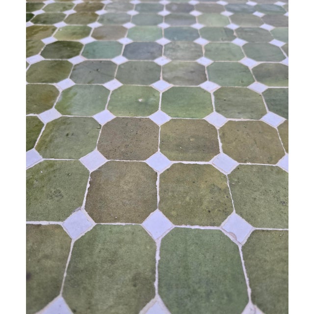 Beautiful handcrafted Moroccan mosaic table featuring an elegant color palette. Measuring 48 inches in diameter, this...