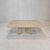Very nice Italian coffee or side table handcrafted out of travertine, 1980s. It has a very nice 3-leg base. It is made of...