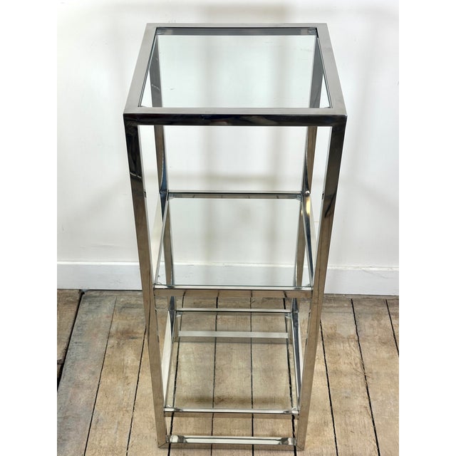 Elegant side table, accent shelf, end table, or bedside table in chrome-plated metal and glass, with a simple and timeless...