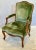 A finely crafted Louis XV style fauteuil lounge chair by J. Robert Scott, featuring a hand-carved wood frame and...