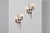 An exceptional pair of sculptural brass wall sconces designed by Angelo Brotto for Esperia, Italy, circa 1970. These...