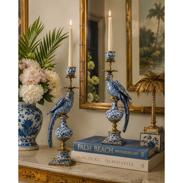Bold, theatrical, and steeped in design history, this magnificent blue and white porcelain parrot candle holder is an...