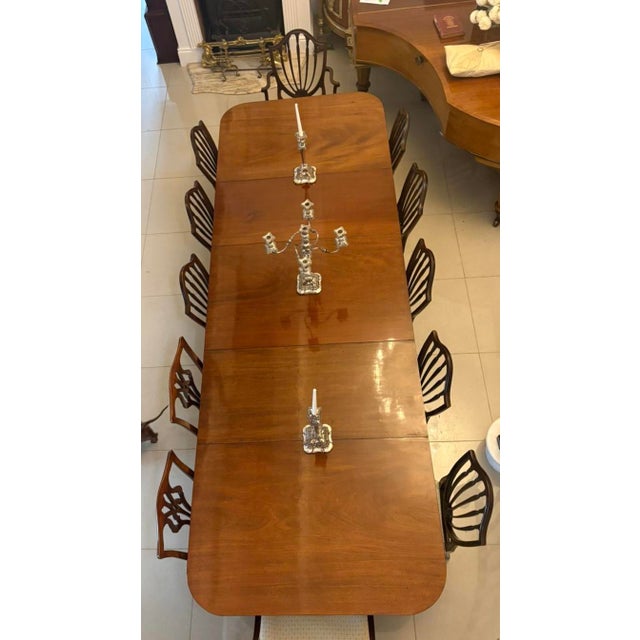 A superb antique Georgian figured mahogany 3 pillar extending dining table of outstanding scale and elegant timeless...