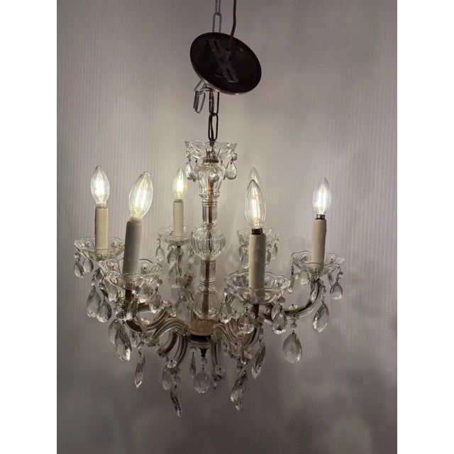 Design Plus Gallery presents a Vintage Crystal + Glass Chandelier. This vintage six-light chandelier features elegant...