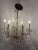 Design Plus Gallery presents a Vintage Crystal + Glass Chandelier. This vintage six-light chandelier features elegant...