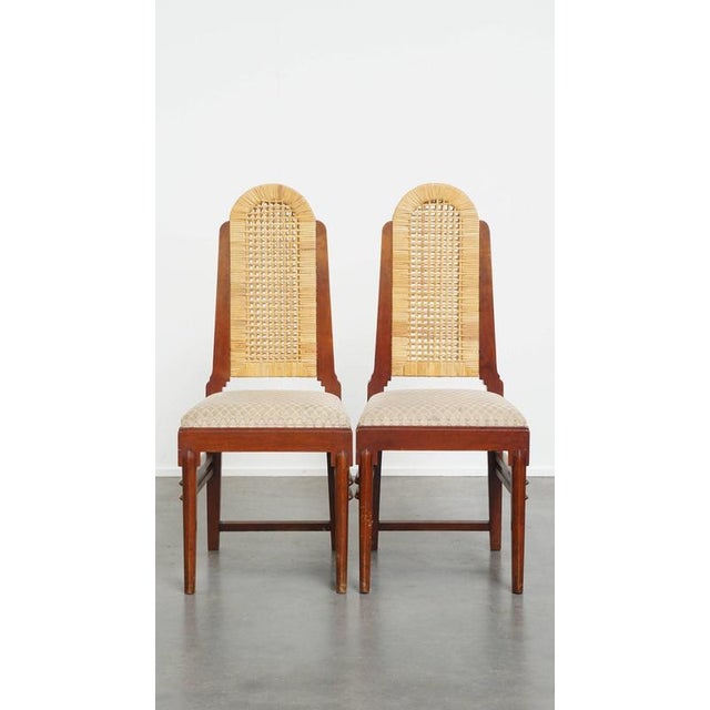 Offered for sale is this attractive set of two wooden Art Deco dining chairs with wicker seats and backrests. This...