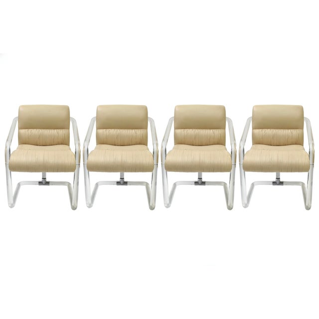 These iconic vintage signed Lion N Frost lucite and channeled leather dining chairs are very substantial and very...