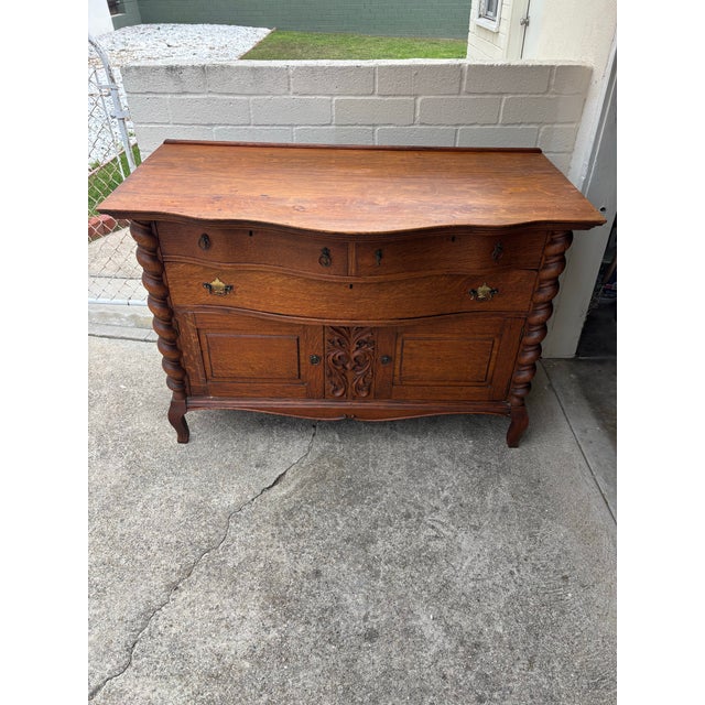 Antique tiger oak buffet / sideboard, featuring barley twist columns and serpentine front. Excellent condition. Normal...