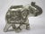 Ornate silver metal Indian figure. Incredible detail on all sides, it measures 7.5"W x 5.5'H x 3"D, and is in excellent...