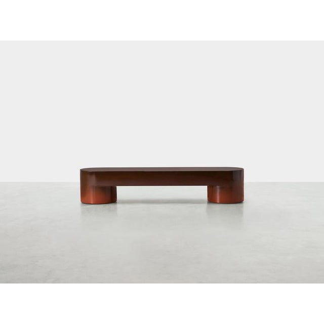 Nuanced brown lazy-o bench by somaschini dimensions: w 180 x d 40 x h 45 cm materials: lightened mdf monolithic structure....