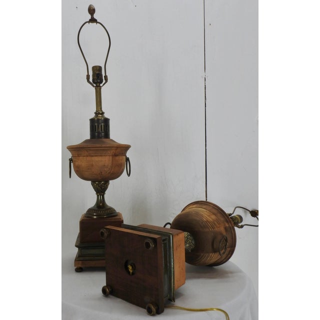 A pair of Frederick Cooper lamps featuring waxed walnut and antique brass finished metal enhancements. New socket...